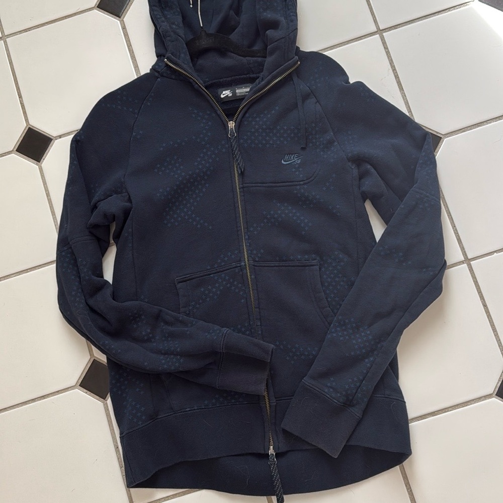 Nike SB navy blue hoodie with star accents.